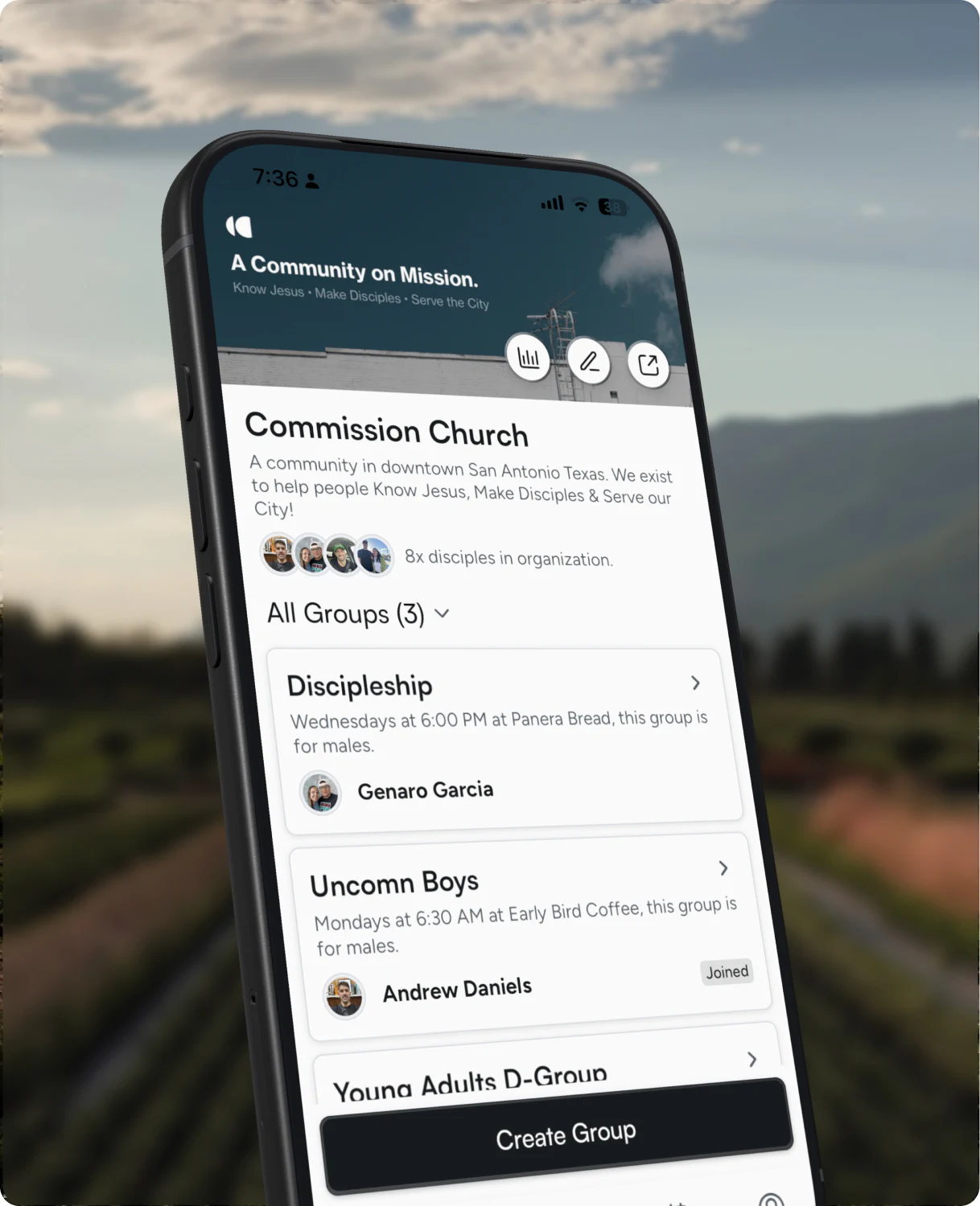 The Uncomn organization details screen on a phone, floating over a vineyard at dusk